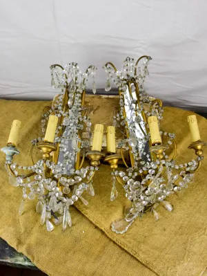 Pair of antique Italian wall sconces with pendants and mirrored backs